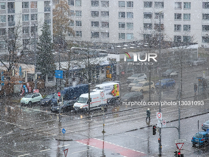 Snow Rain Falling On Wet Traffic Intersection In Munich