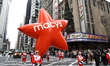 The Macy's Red Star balloon heads down the parade route during the 99th Macy's Thanksgivin...