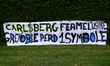Protesters hold a banner against the closure of the Teisseire syrup factory in Crolles, Is...