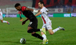 N'Dri Philippe Kofi of Hamrun Spartans is closely followed by Toni Kollega of Lincoln Red...