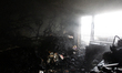 A burnt-out apartment is in a residential building in the Darnytskyi district damaged by a...