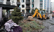 An excavator is used at a housing estate damaged by a Russian missile and drone attack in...