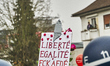 Protesters sign ''Liberte, Egalite, Fckafde'' in Giessen, Germany, on November 28, 2025, d...