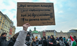 KRAKOW, POLAND – NOVEMBER 29:An activist holds a placard with a quote widely attributed t...