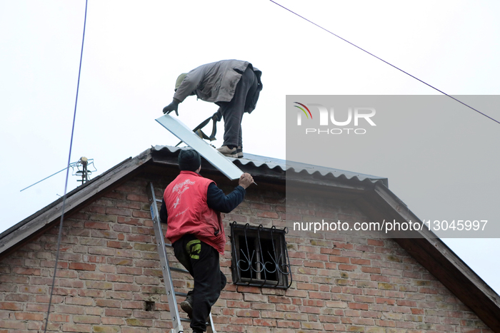Shelling of Vyshneve: residents clear debris and repair rooftops