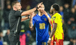 Referee Adam Herczeg speaks to Jay Stansfield of Birmingham City and Jeremy Ngakia of Watf...