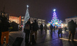 KRAKOW, POLAND – DECEMBER 1:A Christmas-themed carousel is seen next to a decorated Chris...