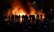 Protesters burn dumpsters on the street during a protest against Bulgaria's 2026 national...