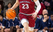 Ethan Roberts, 23, of the Penn Quakers drives the ball during an NCAA men's basketball gam...
