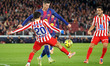 Robert Lewandowski and Giuliano Simeone play during the match between FC Barcelona and Clu...