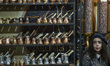 A young Iranian woman sits next to the coffee accessories during Iran's Coffee, Non-Alcoho...