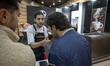 An Iranian visitor smells coffee while visiting Iran's Coffee, Non-Alcoholic Beverages, an...