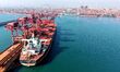 The cargo ship unloads imported iron ore at the Qingdao Port ore terminal in Qingdao, Shan...