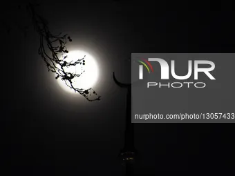 The last supermoon, also known as the cold moon, rises behind the clouds in Srinagar, Kashmir, India, on December 4, 2025.  by Faisal Khan/NurPhoto