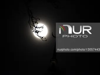 The last supermoon, also known as the cold moon, rises behind the clouds in Srinagar, Kashmir, India, on December 4, 2025.  by Faisal Khan/NurPhoto