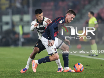 The contrast between Emil Holm of Bologna FC 1909 and Christian Ordonez of Parma Calcio 1913 occurs during the Coppa Italia football match b... by Emanuele Comincini/NurPhoto