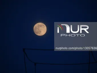 The last supermoon, also known as the cold moon, rises in Srinagar, Kashmir, India, on December 4, 2025.  by Faisal Khan/NurPhoto