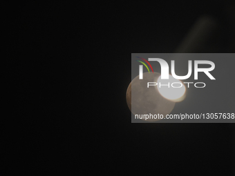 The last supermoon, also known as the cold moon, rises behind the street lights in Srinagar, Kashmir, India, on December 4, 2025.  by Faisal Khan/NurPhoto