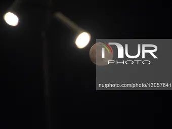 The last supermoon, also known as the cold moon, rises behind the street lights in Srinagar, Kashmir, India, on December 4, 2025.  by Faisal Khan/NurPhoto
