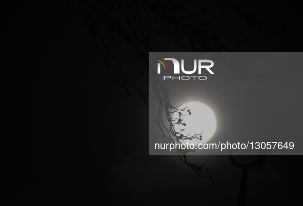 The last supermoon, also known as the cold moon, rises behind the clouds in Srinagar, Kashmir, India, on December 4, 2025.  by Faisal Khan/NurPhoto