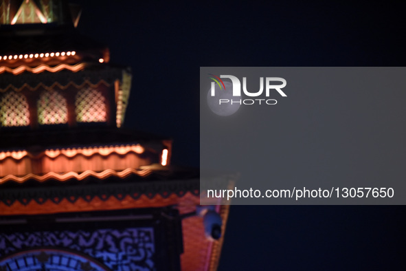 The last supermoon, also known as the cold moon, rises behind the clock tower in Srinagar, Kashmir, India, on December 4, 2025.  by Faisal Khan/NurPhoto