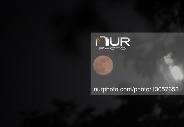 The last supermoon, also known as the cold moon, rises in Srinagar, Kashmir, India, on December 4, 2025.  by Faisal Khan/NurPhoto