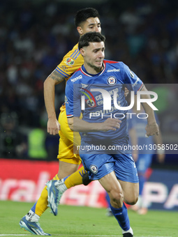 Angel Correa #3 of Club Tigres and Jose Paradelas #20 of Cruz Azul battle for the ball during the first leg semifinal match of Liga MX betwe... by Eyepix/NurPhoto