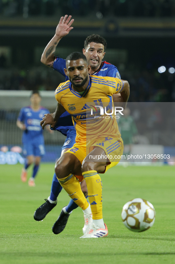 Joaquim #2 of Club Tigres and Jose Ignacio Rivero #15 of Cruz Azul battle for the ball during the first leg semifinal match of Liga MX betwe... by Eyepix/NurPhoto