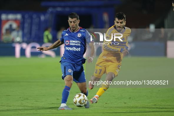 Angel Correa #7 of Club Tigres and Erik Lira #6 of Cruz Azul battle for the ball during the first leg semifinal match of Liga MX between Clu... by Eyepix/NurPhoto