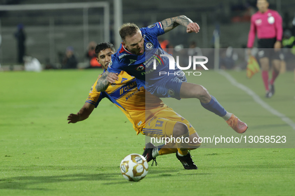 Jesus Garza #14 of Club Tigres and Carlos Rodolfo Rotondi #29 of Cruz Azul battle for the ball during the first leg semifinal match of Liga... by Eyepix/NurPhoto