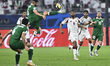 Abdulaziz Hatem of Qatar and Elmar Abraham of Syria are in action during the Group A FIFA...