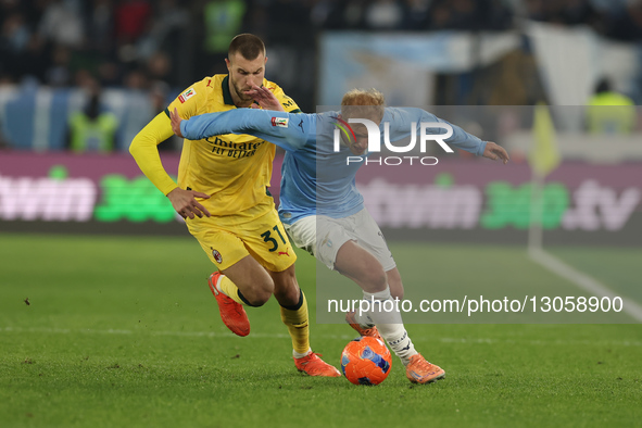 Gustav Isaksen of Lazio and Strahinja Pavlovic of Milan play during the Coppa Italia soccer match, round of 16, between SS Lazio and AC Mila... by Ciro De Luca/NurPhoto