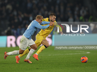 Gustav Isaksen of Lazio and Strahinja Pavlovic of Milan play during the Coppa Italia soccer match, round of 16, between SS Lazio and AC Mila... by Ciro De Luca/NurPhoto