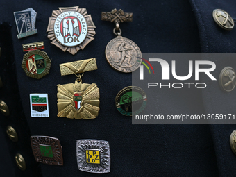 KATOWICE, POLAND – DECEMBER 4:
A member of the mining community carries decorations from the former PRL (People’s Republic of Poland), as he... by Artur Widak/NurPhoto