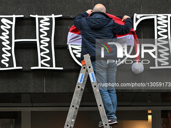 KATOWICE, POLAND – DECEMBER 4:
A man decorates a shop sign with Christmas ornaments in central Katowice, Silesian Voivodeship, Poland, on De... by Artur Widak/NurPhoto