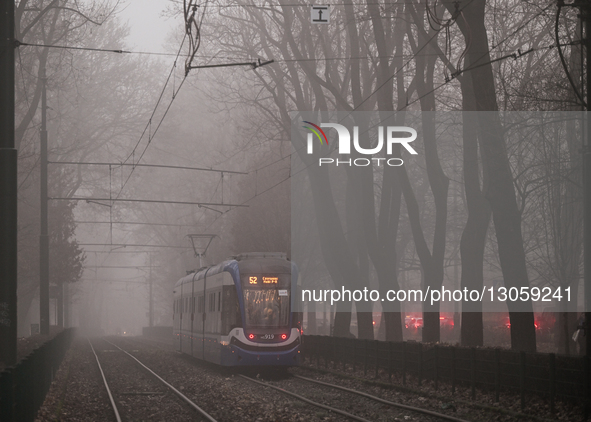 KRAKOW, POLAND - DECEMBER 4:
Tram HG919, a Pesa 2014N 'Krakowiak,' is seen operating on Dietla Street during foggy conditions in Krakow, Pol... by Artur Widak/NurPhoto