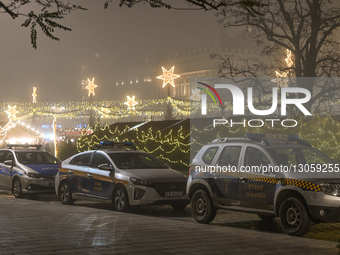 KRAKOW, POLAND – DECEMBER 4:
A line of City Police vehicles is parked along the Christmas Market in Krakow’s UNESCO-listed Main Market Squar... by Artur Widak/NurPhoto