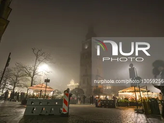 KRAKOW, POLAND – DECEMBER 4:
The Town Hall Tower is seen in Krakow’s UNESCO-listed Main Market Square, with security barriers protecting ent... by Artur Widak/NurPhoto