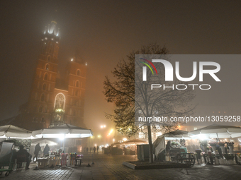 KRAKOW, POLAND – DECEMBER 4:
A view of Krakow’s Main Market Square and St. Mary’s Basilica amid dense afternoon fog, in Krakow, Poland, on D... by Artur Widak/NurPhoto