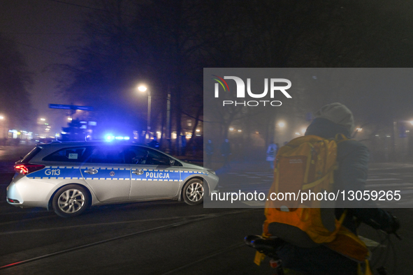 KRAKOW, POLAND – DECEMBER 4:
A police car drives through central Krakow as evening fog blankets the city, in Krakow, Poland, on December 4,... by Artur Widak/NurPhoto