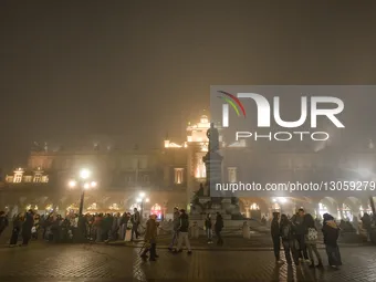 KRAKOW, POLAND – DECEMBER 4:
A view of Krakow’s Main Market Square with Adam Mickiewicz statue and the Cloth Hall amid dense afternoon fog,... by Artur Widak/NurPhoto