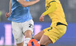 Toma Basic of S.S. Lazio and Adrien Rabiot of A.C. Milan are in action during the round of...