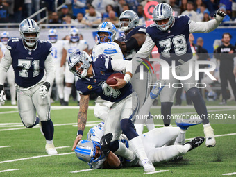 DETROIT,MICHIGAN-DECEMBER 4: Dallas Cowboys quarterback Dak Prescott #4 gets sacked by Detroit Lions linebacker Al-Quadin Muhammad #96 durin... by Jorge Lemus/NurPhoto