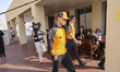 Lando Norris of the United Kingdom in the paddock walking before the press conference, the...