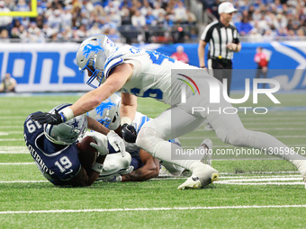 DETROIT,MICHIGAN-DECEMBER 4: Dallas Cowboys wide receiver Ryan Flournoy #19 gest tackled by Detroit Lions cornerback D.J. Reed #4 during the... by Jorge Lemus/NurPhoto