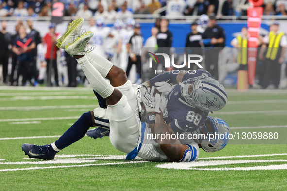 DETROIT,MICHIGAN-DECEMBER 4: Dallas Cowboys wide receiver CeeDee Lamb #88 gets tackled by Detroit Lions cornerback D.J. Reed #4 during the s... by Jorge Lemus/NurPhoto