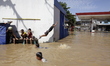 Children play during the flood in Dayeuhkolot, Bandung Regency, West Java, Indonesia. Afte...