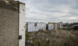 The walls remain standing at a homestead on Partyzanska Street, destroyed by Russian shell...