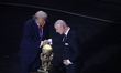 FIFA President Gianni Infantino is with US President Donald Trump, who presents him with a...