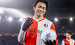 Feyenoord player Ayase Ueda holds the ball and celebrates the victory after the match Feye...